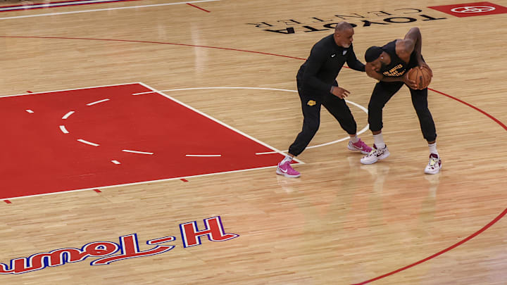 Nov 8, 2023; Houston, Texas, USA;  Los Angeles Lakers forward LeBron James (23) practices with assistant coach Phil Handy before playing against the Houston Rockets at Toyota Center. Mandatory Credit: Thomas Shea-Imagn Images