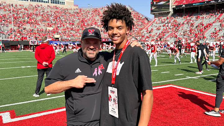 Quarterback Trae Taylor with Nebraska football coach Matt Rhule last fall.