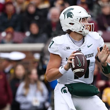 Nov 1, 2025; Minneapolis, Minnesota, USA; Michigan State Spartans quarterback Alessio Milivojevic (11) looks to pass against the Minnesota Golden Gophers during the first half at Huntington Bank Stadium. Mandatory Credit: Matt Krohn-Imagn Images