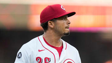 Cincinnati Reds pitcher Chase Burns (26) returns to the dugout