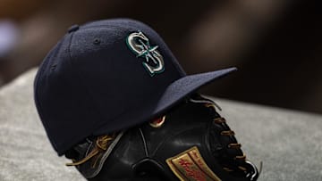Apr 27, 2015; Arlington, TX, USA; A view of a Seattle Mariners hat and baseball glove during the game between the Texas Rangers and the Mariners at Globe Life Park in Arlington. The Mariners defeated the Rangers 3-1. Mandatory Credit: Jerome Miron-Imagn Images