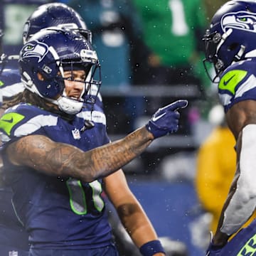 Seattle Seahawks wide receiver Jaxon Smith-Njigba celebrates with DK Metcalf after catching a touchdown.