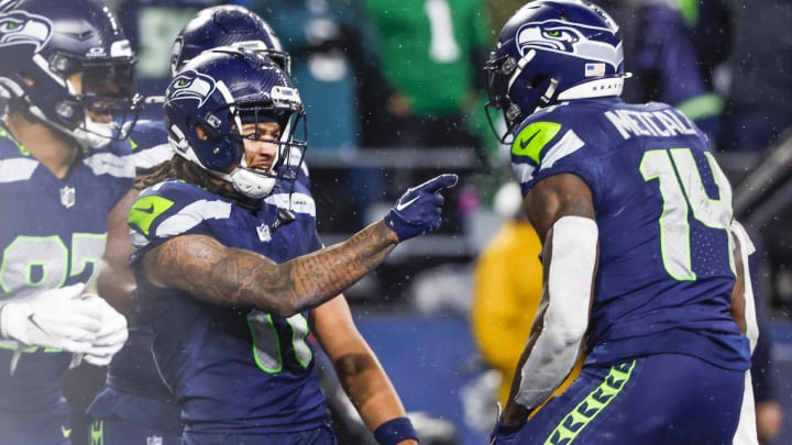 Dec 18, 2023; Seattle, Washington, USA; Seattle Seahawks wide receiver Jaxon Smith-Njigba (11) celebrates with wide receiver DK Metcalf (14) after catching a touchdown pass against the Philadelphia Eagles during the fourth quarter at Lumen Field.