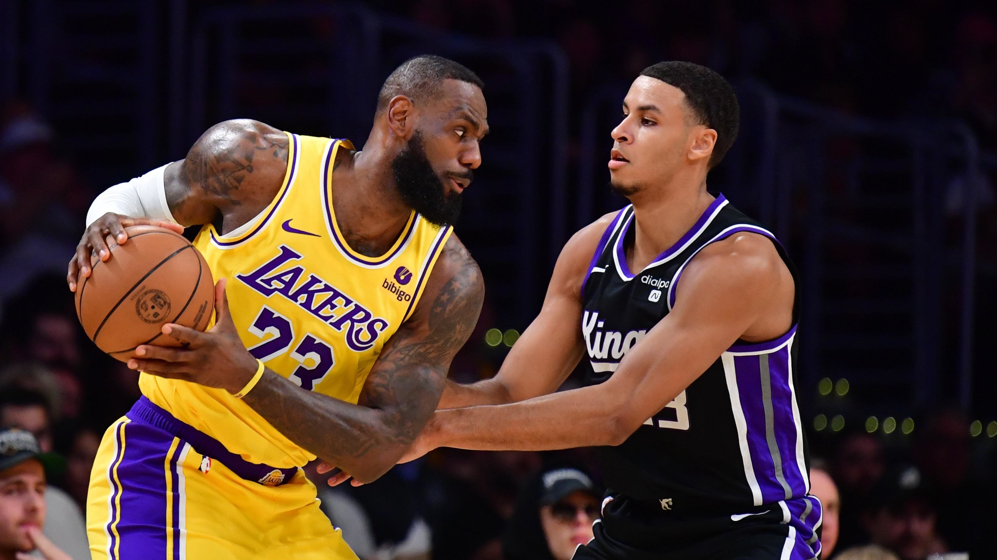 Mar 6, 2024; Los Angeles, California, USA;  Los Angeles Lakers forward LeBron James (23) guarded by Sacramento Kings forward Keegan Murray (13).