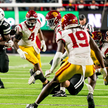 Nebraska running back Emmett Johnson gains yards against USC defense on Saturday.