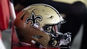 Aug 10, 2024; Glendale, Arizona, USA; Detailed view of a New Orleans Saints helmet during a preseason NFL game at State Farm Stadium. Mandatory Credit: Mark J. Rebilas-Imagn Images