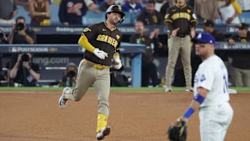 Oct 6, 2024; Los Angeles, California, USA; San Diego Padres catcher Kyle Higashioka (20) runs after hitting a solo home run against the Los Angeles Dodgers in the ninth inning during game two of the NLDS for the 2024 MLB Playoffs at Dodger Stadium. Mandatory Credit: Kiyoshi Mio-Imagn Images