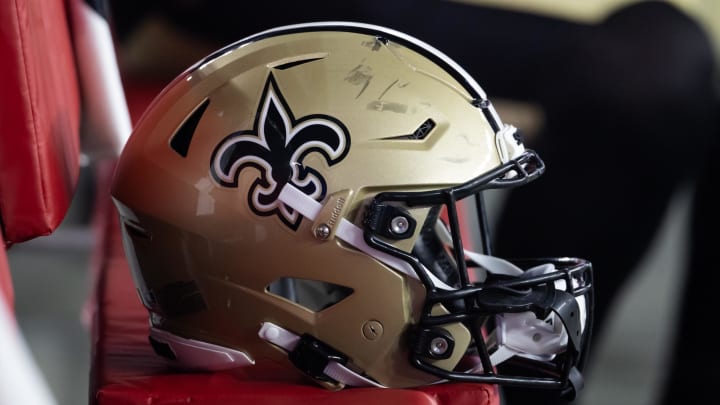 Aug 10, 2024; Glendale, Arizona, USA; Detailed view of a New Orleans Saints helmet during a preseason NFL game at State Farm Stadium. Mandatory Credit: Mark J. Rebilas-USA TODAY Sports