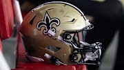 Aug 10, 2024; Glendale, Arizona, USA; Detailed view of a New Orleans Saints helmet during a preseason NFL game at State Farm Stadium. Mandatory Credit: Mark J. Rebilas-Imagn Images