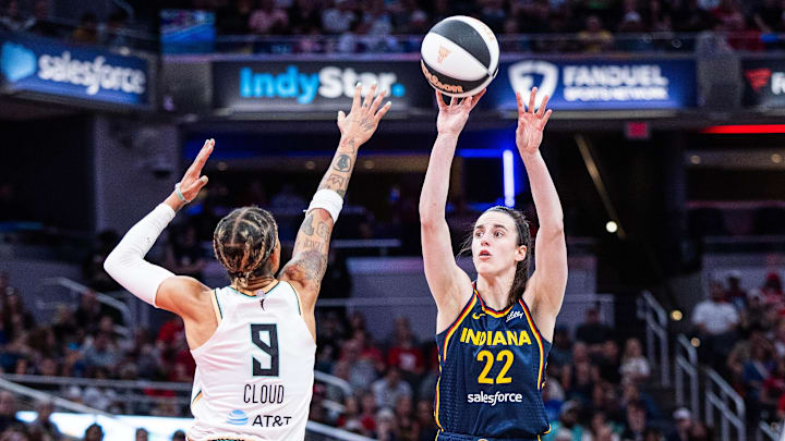 Indiana Fever guard Caitlin Clark (22) shoots the ball while New York Liberty guard Natasha Cloud (9) defends in the first half at Gainbridge Fieldhouse.