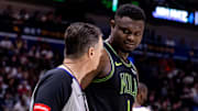 Apr 14, 2024; New Orleans, Louisiana, USA; New Orleans Pelicans forward Zion Williamson (1) talks to referee Pat Fraher (26) after a play against the Los Angeles Lakers during the first half at Smoothie King Center.