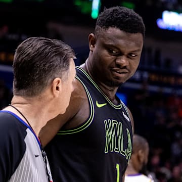 Apr 14, 2024; New Orleans, Louisiana, USA; New Orleans Pelicans forward Zion Williamson (1) talks to referee Pat Fraher (26) after a play against the Los Angeles Lakers during the first half at Smoothie King Center.