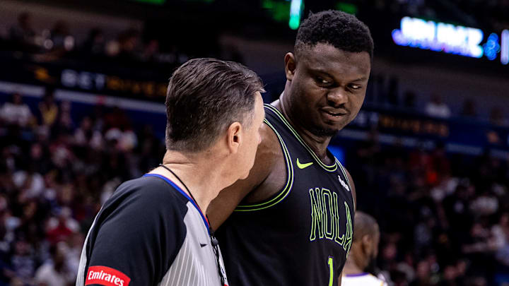 Apr 14, 2024; New Orleans, Louisiana, USA; New Orleans Pelicans forward Zion Williamson (1) talks to referee Pat Fraher (26) after a play against the Los Angeles Lakers during the first half at Smoothie King Center.