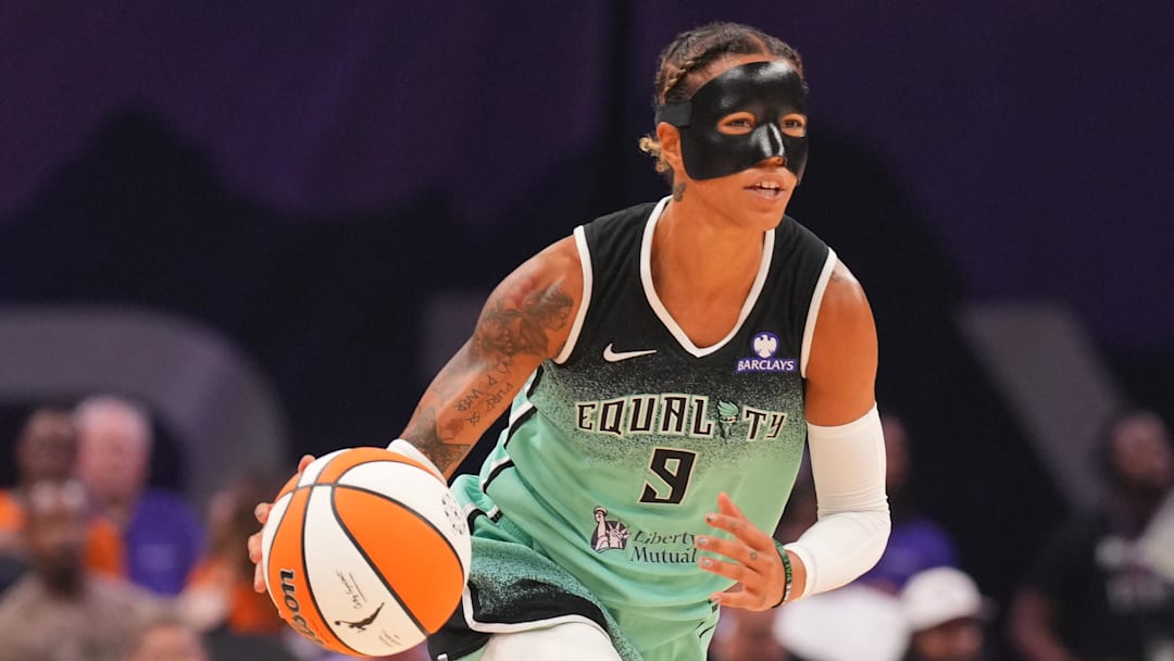 Sep 19, 2025; Phoenix, Arizona, USA; New York Liberty guard Natasha Cloud (9) dribbles against the Phoenix Mercury during the first half of game three of round one for the 2025 WNBA Playoffs at PHX Arena. Mandatory Credit: Joe Camporeale-Imagn Images