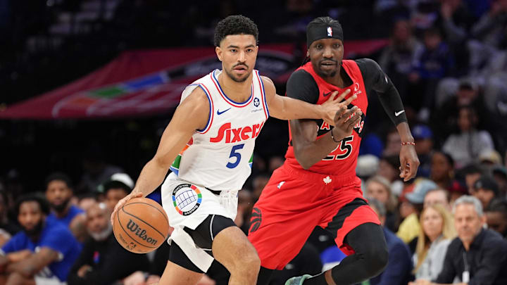 Feb 11, 2025; Philadelphia, Pennsylvania, USA; Philadelphia 76ers guard Quentin Grimes (5) drives with the ball against Toronto Raptors forward Chris Boucher (25) in the second quarter at Wells Fargo Center. Mandatory Credit: Kyle Ross-Imagn Images