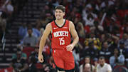 Nov 16, 2025; Houston, Texas, USA; Houston Rockets guard Reed Sheppard (15) smiles after a play during the second quarter against the Orlando Magic at Toyota Center. Mandatory Credit: Troy Taormina-Imagn Images