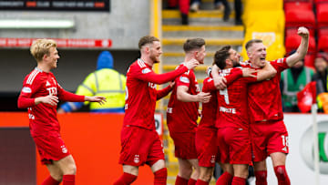 Aflie Dorrington celebrates with his team mates 