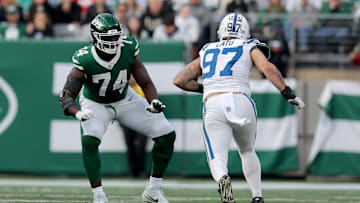 Nov 17, 2024; East Rutherford, New Jersey, USA; New York Jets offensive tackle Olu Fashanu (74) blocks against Indianapolis Colts defensive end Laiatu Latu (97) during the third quarter at MetLife Stadium. 