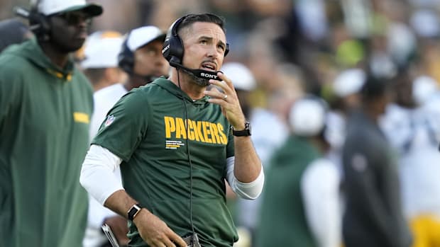 Matt LaFleur wearing a headset during a game
