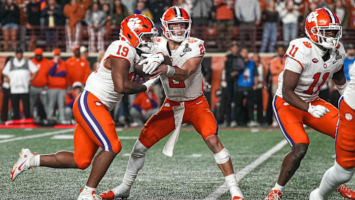 Clemson quarterback Cade Klubnik (2) hands the ball off to running back Keith Adams Jr. (19) during the game against the Texas Longhorns in the first round of the College Football Playoffs at Darrell K Royal-Texas Memorial Stadium on Saturday, Dec. 21, 2024.