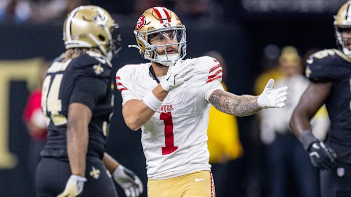 Sep 14, 2025; New Orleans, Louisiana, USA;  San Francisco 49ers wide receiver Ricky Pearsall (1) reacts to making a first down against New Orleans Saints defensive end Cameron Jordan (94) during the first half at Caesars Superdome. Mandatory Credit: Stephen Lew-Imagn Images