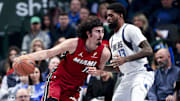 Feb 13, 2025; Dallas, Texas, USA;  Miami Heat guard Jaime Jaquez Jr. (11) drives to the basket as Dallas Mavericks forward Naji Marshall (13) defends during the first quarter at American Airlines Center. Mandatory Credit: Kevin Jairaj-Imagn Images