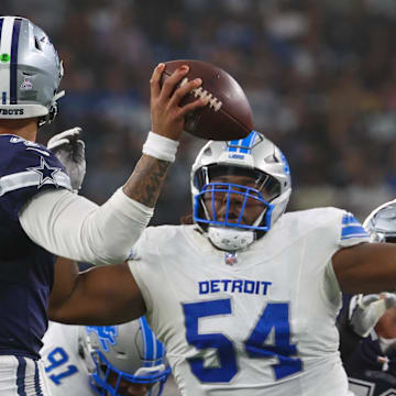 Oct 13, 2024; Arlington, Texas, USA;  Detroit Lions defensive tackle Alim McNeill (54) rushes Dallas Cowboys quarterback Dak Prescott (4) during the second half at AT&T Stadium. Mandatory Credit: Kevin Jairaj-Imagn Images