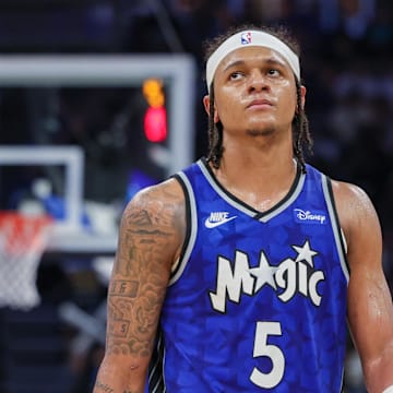 Apr 14, 2024; Orlando, Florida, USA; Orlando Magic forward Paolo Banchero (5) walks up court after a play during the second half against the Milwaukee Bucks at KIA Center. Mandatory Credit: Mike Watters-Imagn Images