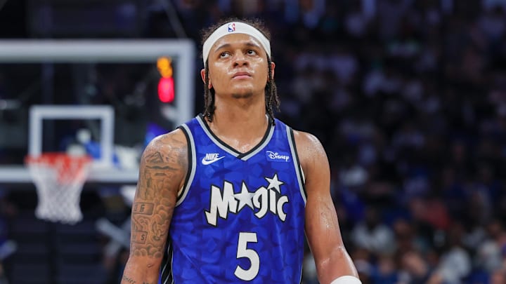 Apr 14, 2024; Orlando, Florida, USA; Orlando Magic forward Paolo Banchero (5) walks up court after a play during the second half against the Milwaukee Bucks at KIA Center. Mandatory Credit: Mike Watters-Imagn Images