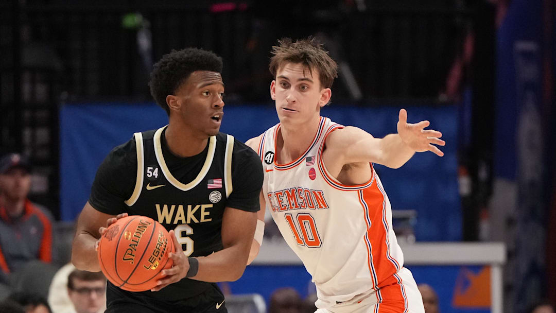 Mar 11, 2026; Charlotte, NC, USA; Wake Forest Demon Deacons guard Myles Colvin (6) with the ball as Clemson Tigers forward Jake Wahlin (10) defends in the second half at Spectrum Center. Mandatory Credit: Bob Donnan-Imagn Images