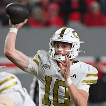 Nov 1, 2025; Raleigh, North Carolina, USA;  Georgia Tech Yellow Jackets quarterback Haynes King (10) throws a pass in the fourth quarter against the NC State Wolfpack at Carter-Finley Stadium. Mandatory Credit: Zachary Taft-Imagn Images