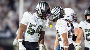 Oregon inside linebacker Jerry Mixon, left and Oregon defensive back Jadon Canady celebrate as the Oregon Ducks face the Penn State Nittany Lions on Sept. 27, 2025, at Beaver Stadium in University Park, Pennsylvania.