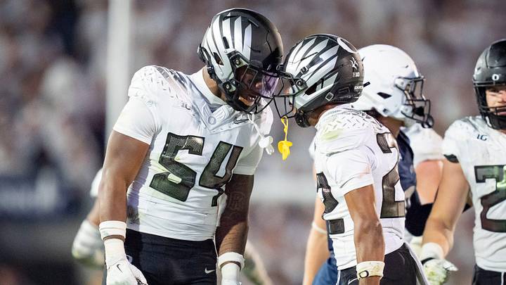 Oregon inside linebacker Jerry Mixon, left and Oregon defensive back Jadon Canady celebrate as the Oregon Ducks face the Penn State Nittany Lions on Sept. 27, 2025, at Beaver Stadium in University Park, Pennsylvania.