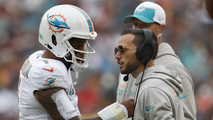 Miami Dolphins coach Mike McDaniel speaks with Tua Tagovailoa during a timeout in a December 2023 game. 