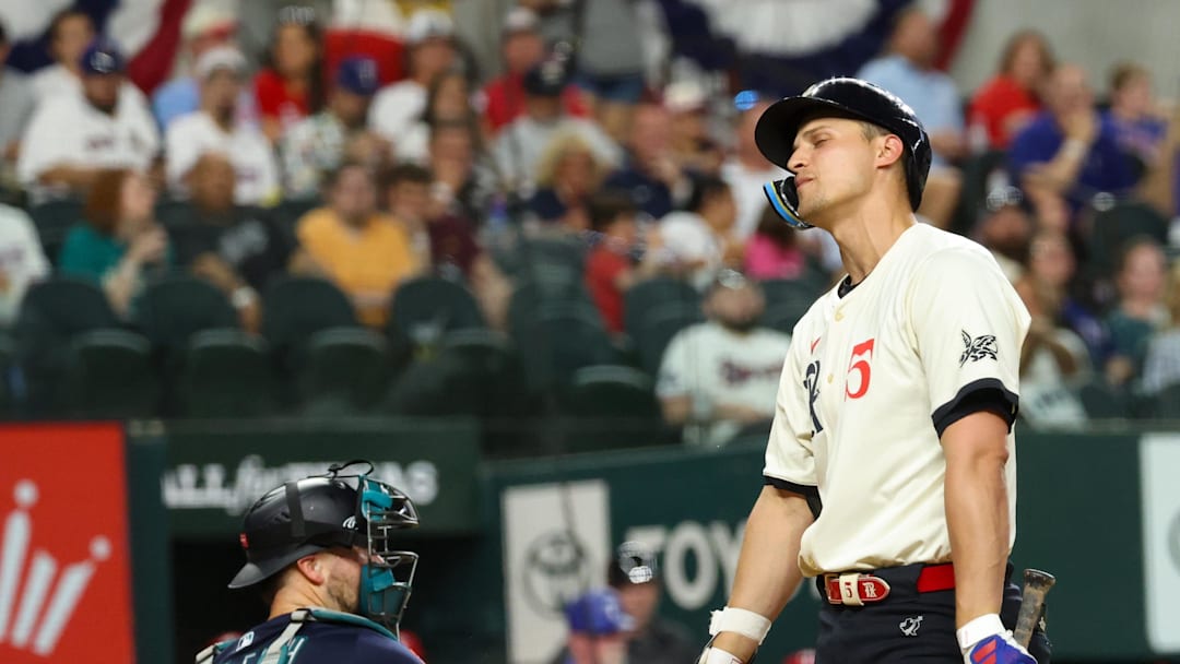 Jun 27, 2025; Arlington, Texas, USA;  Texas Rangers shortstop Corey Seager (5) reacts after striking out during the sixth inning against the Seattle Mariners at Globe Life Field. 