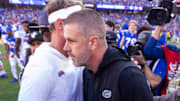 Florida Gators head coach Billy Napier and Mississippi Rebels head coach Lane Kiffin meet on the 50 yard line after the game at Ben Hill Griffin Stadium in Gainesville, FL on Saturday, November 23, 2024. The Gators defeated the Rebels 24-17 [Doug Engle/Gainesville Sun]