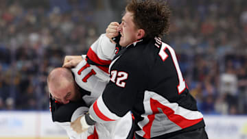 New Jersey Devils right wing Stefan Noesen (11) and Buffalo Sabres center Tage Thompson (72) fight: Timothy T. Ludwig-Imagn Images