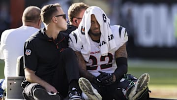 Oct 20, 2024; Cleveland, Ohio, USA; Cincinnati Bengals safety Geno Stone (22) rides the medical cart to the locker room following a leg injury during the fourth quarter against the Cleveland Browns at Huntington Bank Field. Mandatory Credit: Scott Galvin-Imagn Images