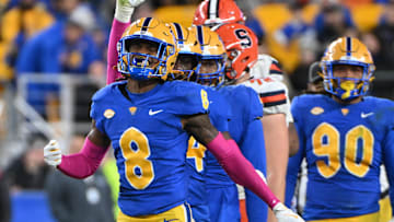 Oct 24, 2024; Pittsburgh, Pennsylvania, USA; Pittsburgh Panthers defensive back Tamon Lynum (8) celebrates a tackle of Syracuse Orange running back LeQuint Allen (1) during the third quarter at Acrisure Stadium. Mandatory Credit: Barry Reeger-Imagn Images