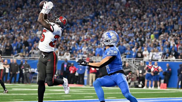 Tampa Bay Buccaneers cornerback Jamel Dean (35) breaks up a pass intended for Lions receiver Amon-Ra St. Brown (14)  