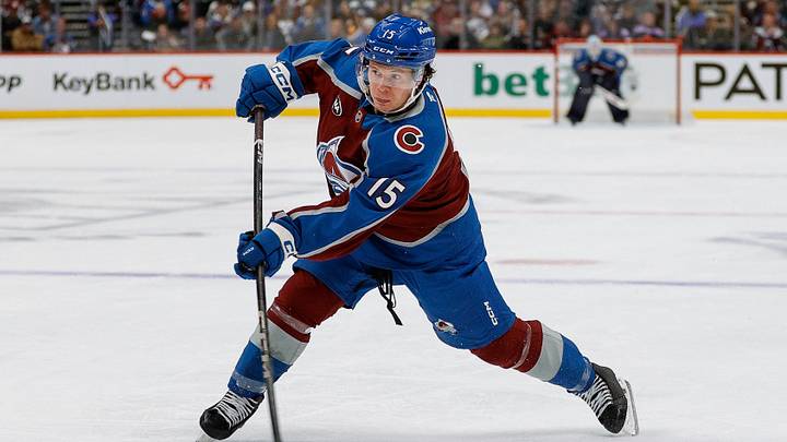 Nov 11, 2025; Denver, Colorado, USA; Colorado Avalanche defenseman Jack Ahcan (15) attempts a shot in the second period against the Anaheim Ducks at Ball Arena. Mandatory Credit: Isaiah J. Downing-Imagn Images