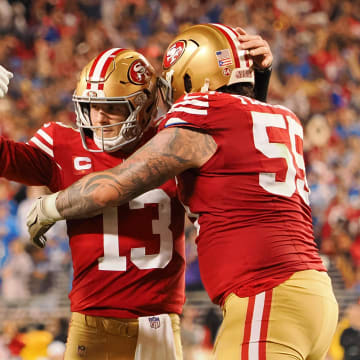 Jan 28, 2024; Santa Clara, California, USA; San Francisco 49ers quarterback Brock Purdy (13) celebrates with guard Jon Feliciano (55) and offensive tackle Trent Williams (71) after a play against the Detroit Lions during the second half of the NFC Championship football game at Levi's Stadium. Mandatory Credit: Kelley L Cox-USA TODAY Sports