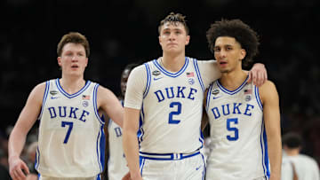 Apr 5, 2025; San Antonio, TX, USA;  Duke Blue Devils forward Cooper Flagg (2) and Duke Blue Devils guard Tyrese Proctor (5) react against the Houston Cougars in the semifinals of the men's Final Four of the 2025 NCAA Tournament at the Alamodome. Mandatory Credit: Robert Deutsch-Imagn Images