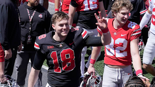 April 13, 2024; Columbus, Ohio, USA; 
Ohio State Buckeyes quarterback Will Howard (18) waves to fans