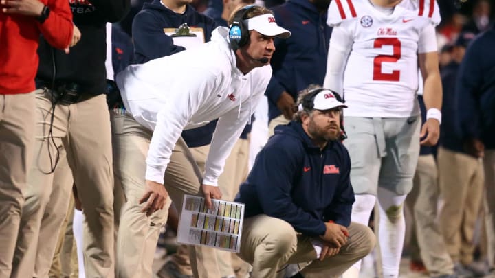 Nov 23, 2023; Starkville, Mississippi, USA; Mississippi Rebels head coach Lane Kiffin (left) and Mississippi Rebels defensive coordinator Pete Golding (right) watch during the second half against the Mississippi State Bulldogs at Davis Wade Stadium at Scott Field. Mandatory Credit: Petre Thomas-USA TODAY Sports