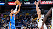 Oct 23, 2025; Indianapolis, Indiana, USA;  Oklahoma City Thunder guard Aaron Wiggins (21) shoots the ball while  Indiana Pacers guard Ben Sheppard (26) defends in the second half at Gainbridge Fieldhouse. Mandatory Credit: Trevor Ruszkowski-Imagn Images