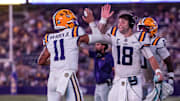 Sep 20, 2025; Baton Rouge, Louisiana, USA;  LSU Tigers quarterback Garrett Nussmeier (18) congratulates LSU Tigers quarterback Michael Van Buren Jr. (11) on a touchdown run against the Southeastern Louisiana Lions during the second half at Tiger Stadium. Mandatory Credit: Stephen Lew-Imagn Images