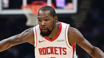 Nov 19, 2025; Cleveland, Ohio, USA; Houston Rockets forward Kevin Durant (7) drives on Cleveland Cavaliers forward De'Andre Hunter (12) during the first half at Rocket Arena. Mandatory Credit: David Dermer-Imagn Images