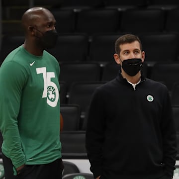 Jan 25, 2022; Boston, Massachusetts, USA; Boston Celtics president of basketball operations Brad Stevens (right) watches warm-ups with player development staff member Steve Tchiengang before their game against the Sacramento Kings at TD Garden. Mandatory Credit: Winslow Townson-Imagn Images