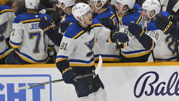 Mar 27, 2025; Nashville, Tennessee, USA;  St. Louis Blues center Dylan Holloway (81) against the Nashville Predators during the third period at Bridgestone Arena. Mandatory Credit: Steve Roberts-Imagn Images